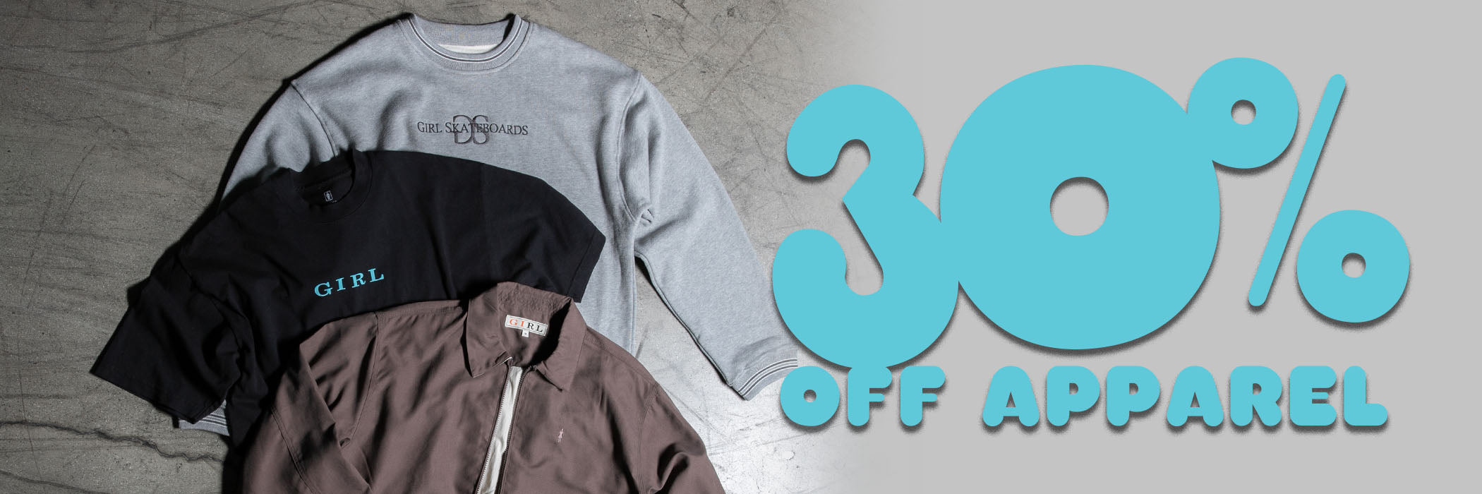 Three sweatshirts on a wooden floor with a '30% off apparel' sign in the background.