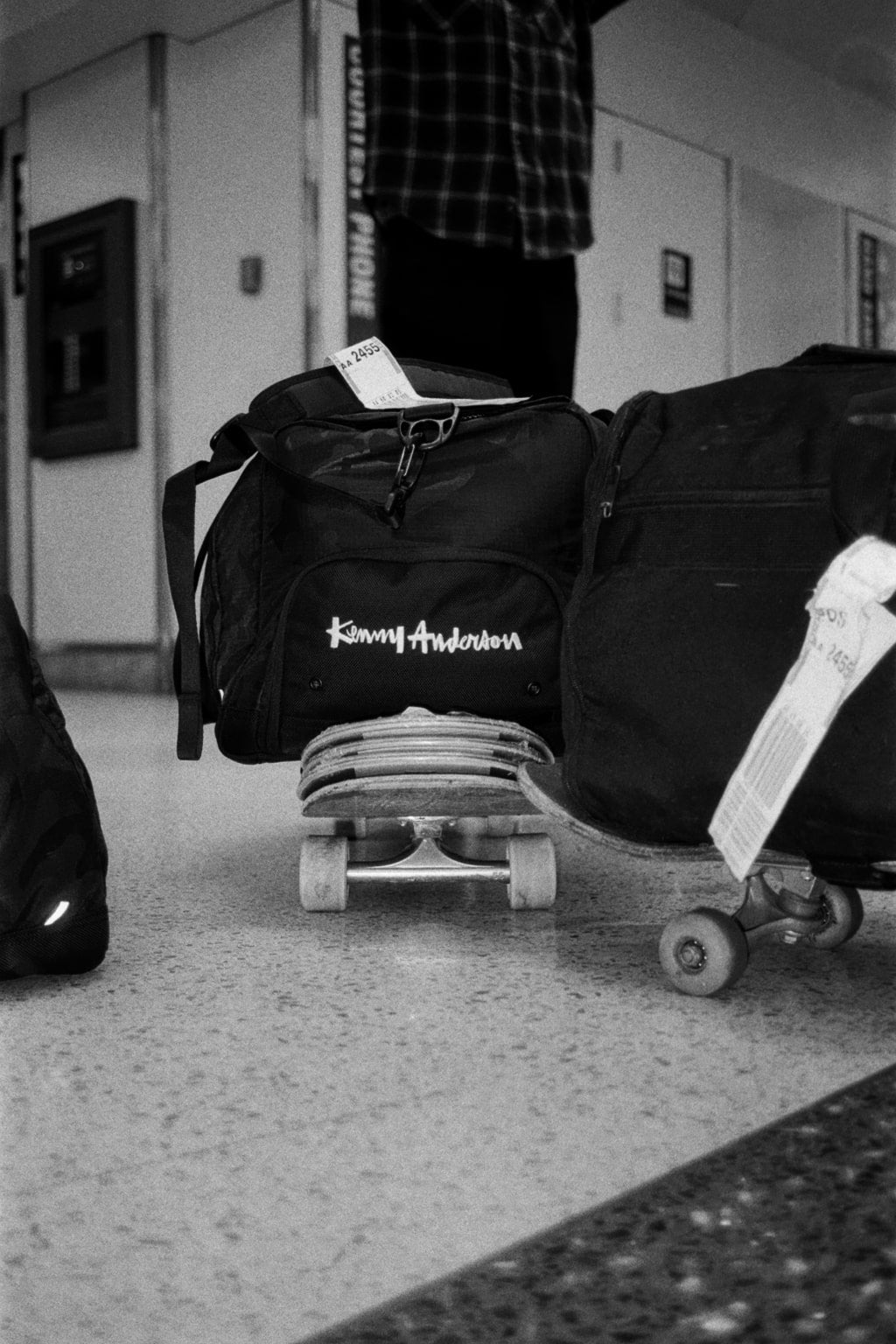 A kenny anderson bag on top of some skateboards