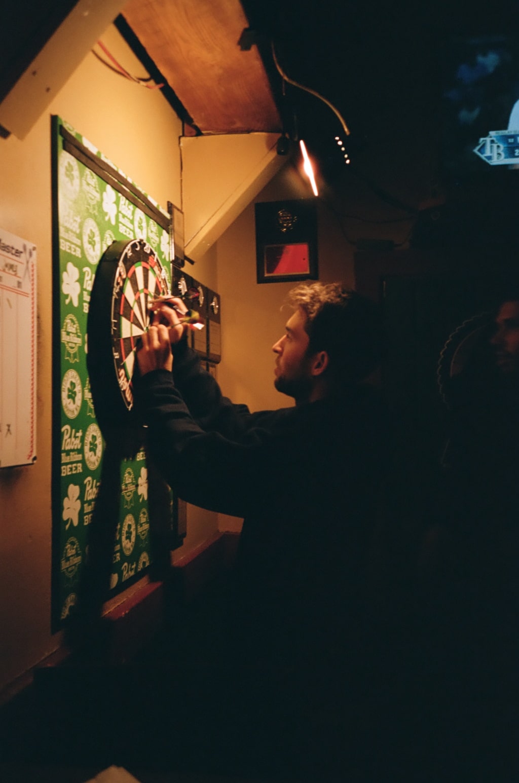 Pulling darts off of a dart board