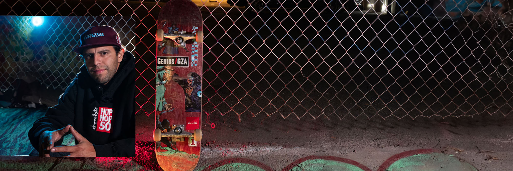 Alvarez portrait near a fence with a skateboard